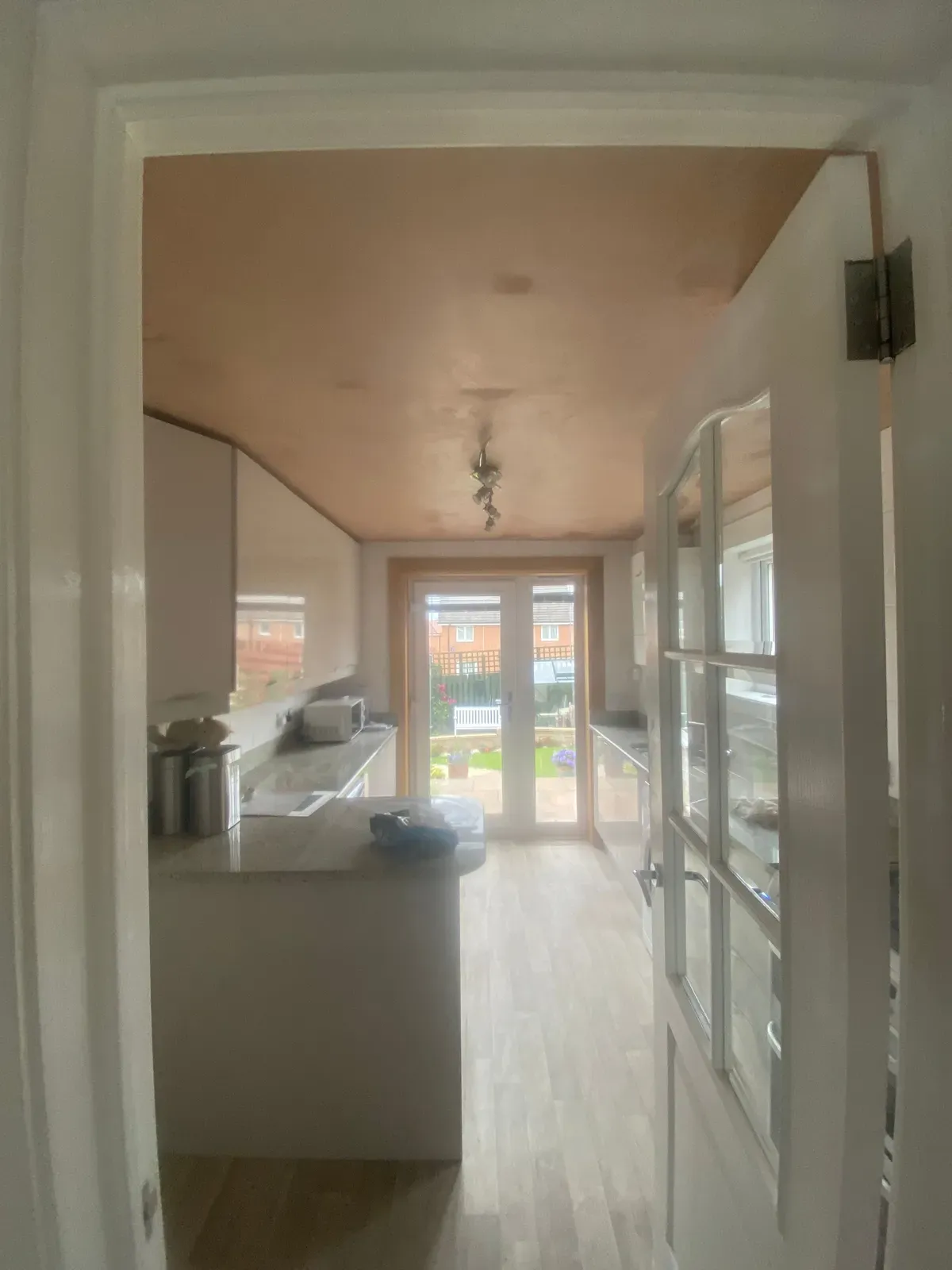 A kitchen diner ceiling covered over the old artex and finished flat