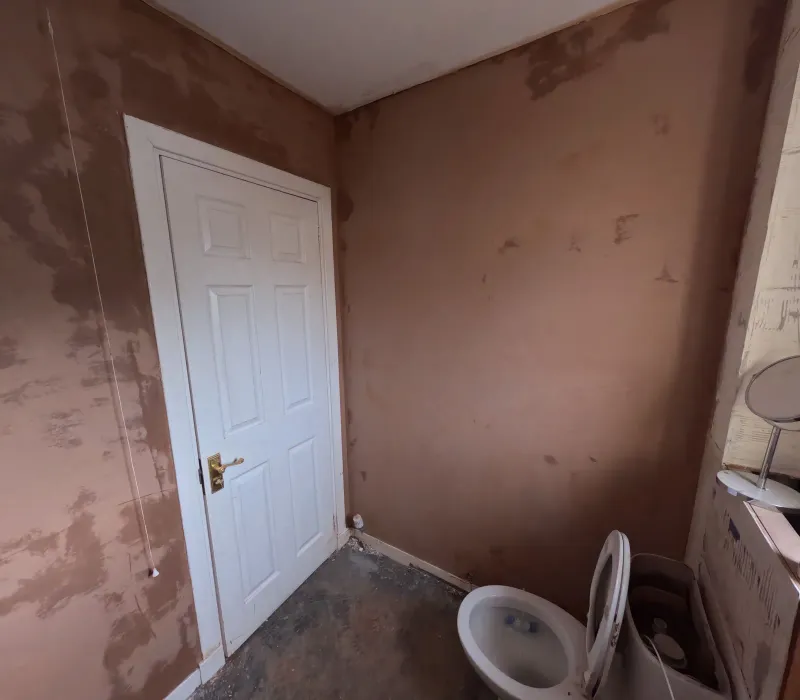 Bathroom walls freshly plastered and ready for tiling