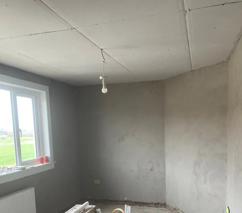 Bedroom walls with the bonding coat on, before the finish coat