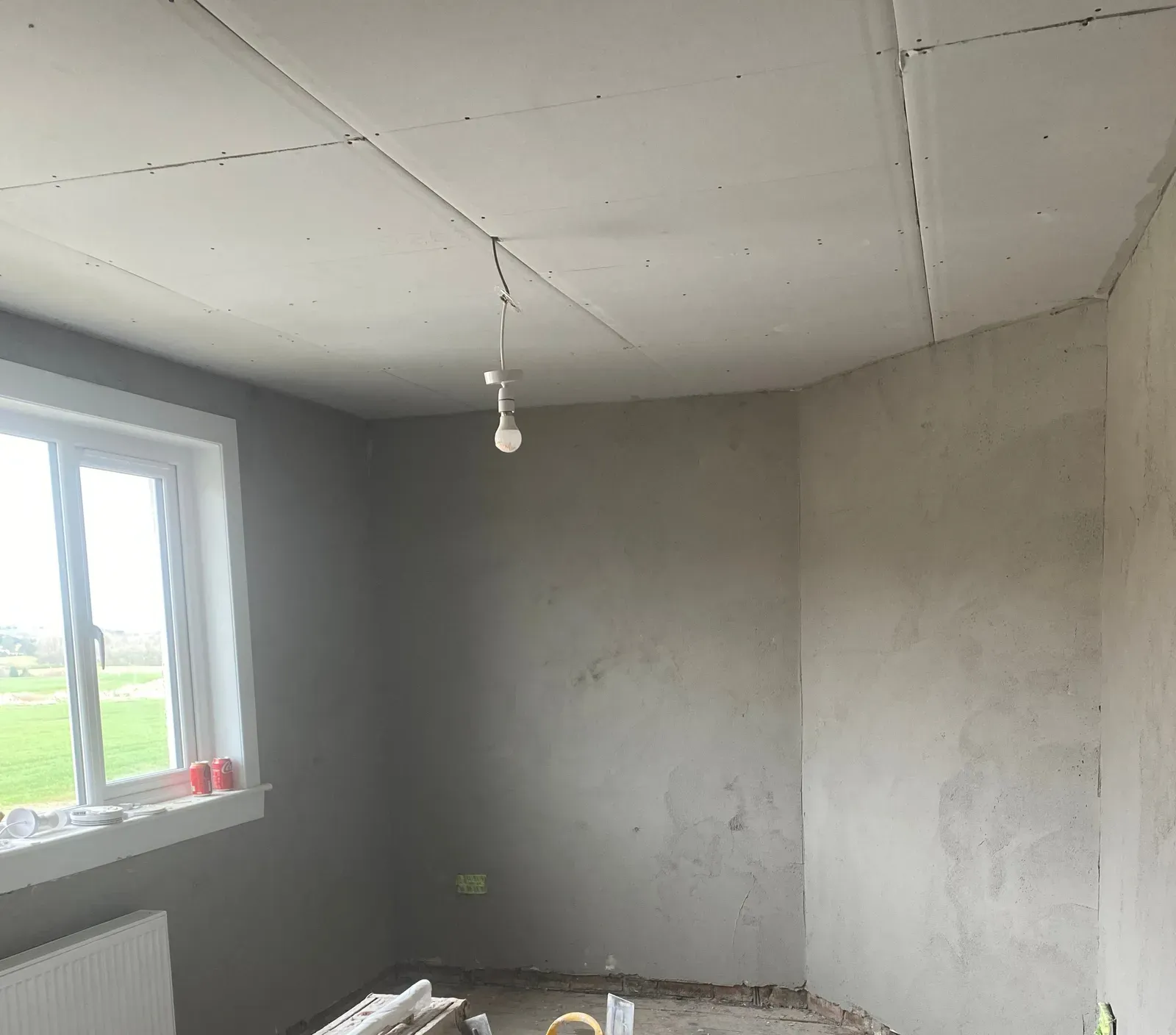 Bedroom walls with the bonding coat applied, before the finish coat goes on