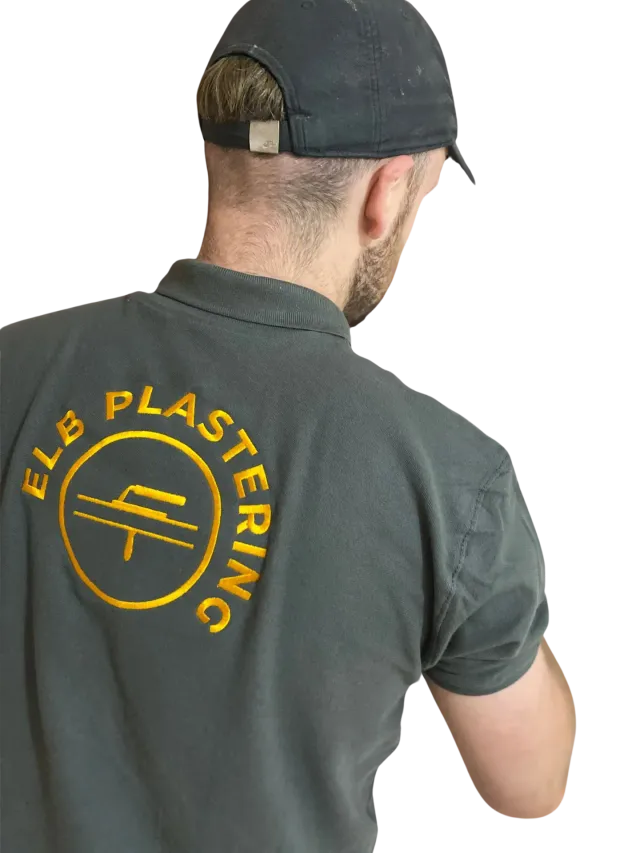 Dean from ELB Plastering in a branded work polo shirt and cap