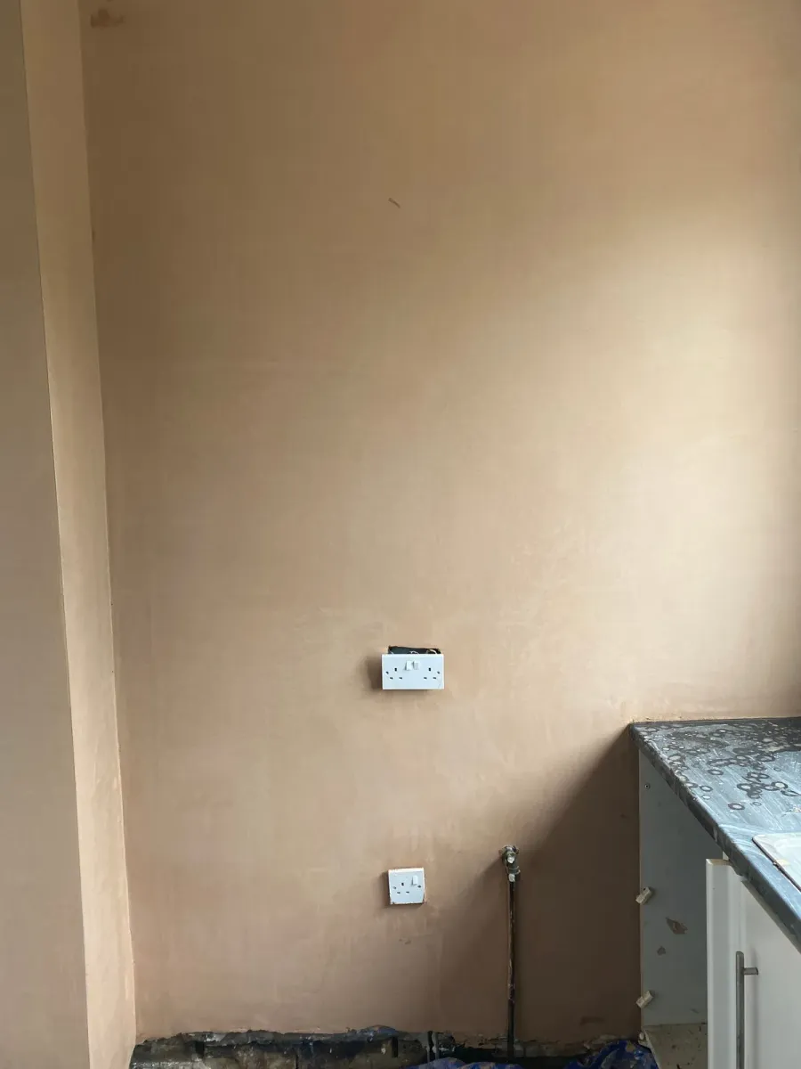 The same kitchen wall replastered and finished smooth