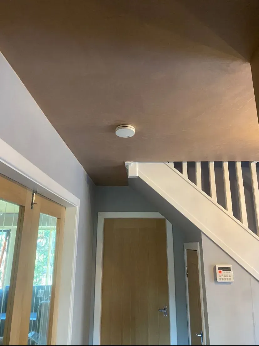 The same hallway ceiling covered over and finished smooth