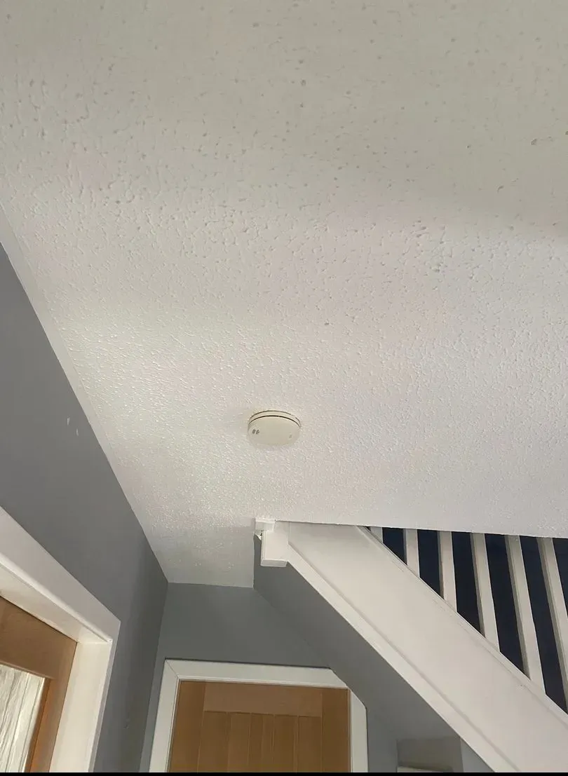 Hallway ceiling with a textured artex finish