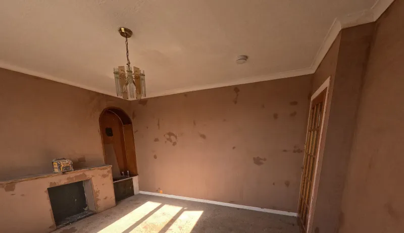 Living room fireplace wall freshly plastered