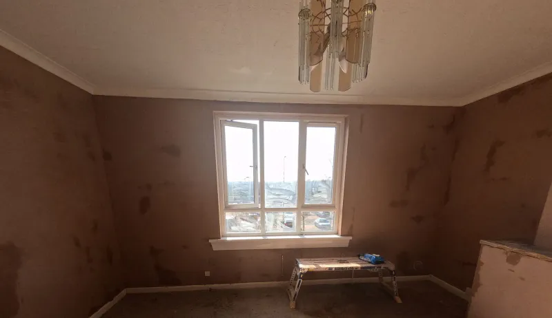 Living room window wall freshly plastered